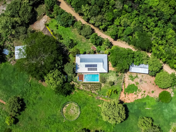 Aerial view of 5 acre property with a three bedroom house and casita