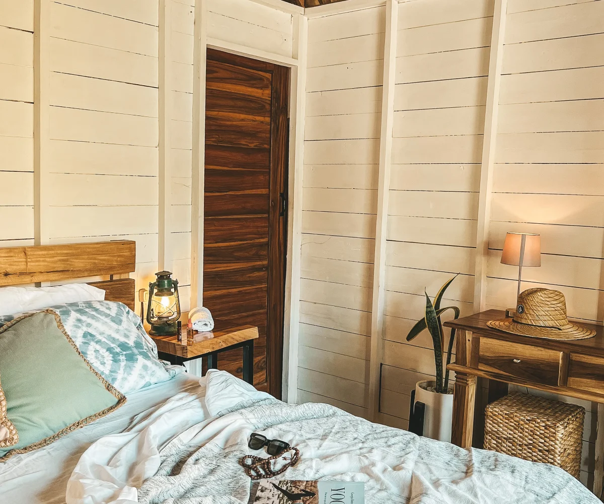 Cozy bungalow bedroom interior at Monoloko Lodge boutique surf retreat near Playa Santana, Tola, Nicaragua