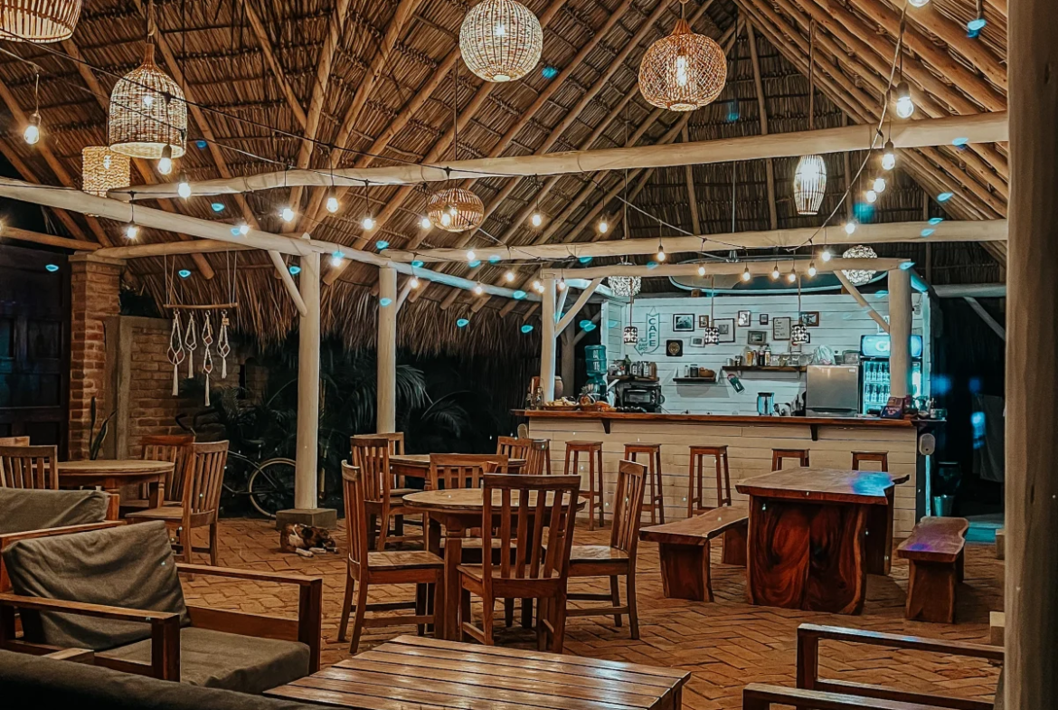 Open-air restaurant and dining area at Monoloko Lodge near Playa Santana, Tola