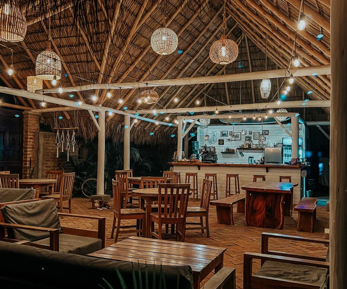 Open-air restaurant and dining area at Monoloko Lodge near Playa Santana, Tola
