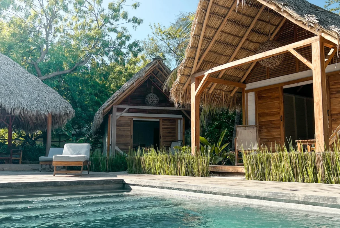 Pool and sun terrace at Monoloko Lodge boutique surf retreat in Popoyo, Tola, Nicaragua