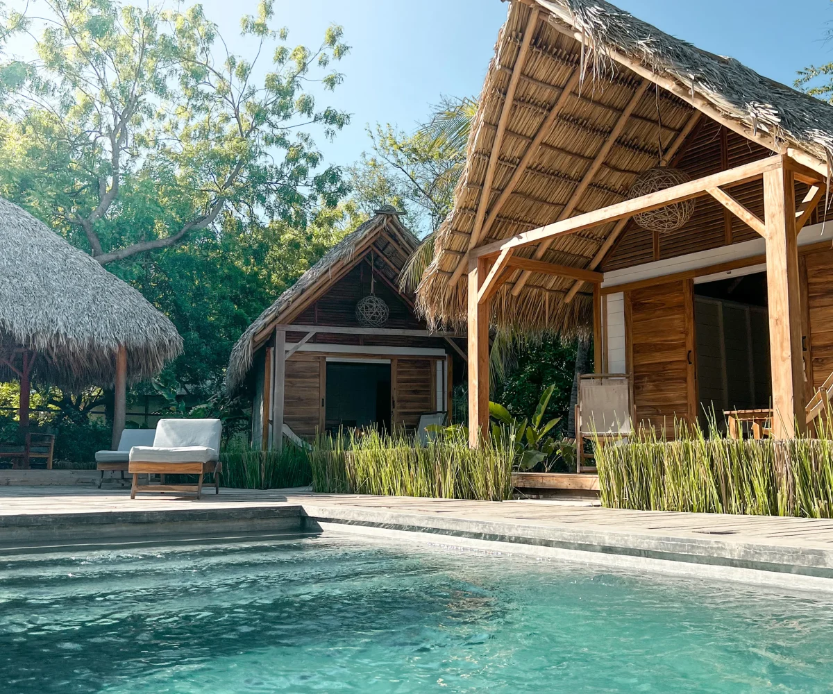 Pool and sun terrace at Monoloko Lodge boutique surf retreat in Popoyo, Tola, Nicaragua