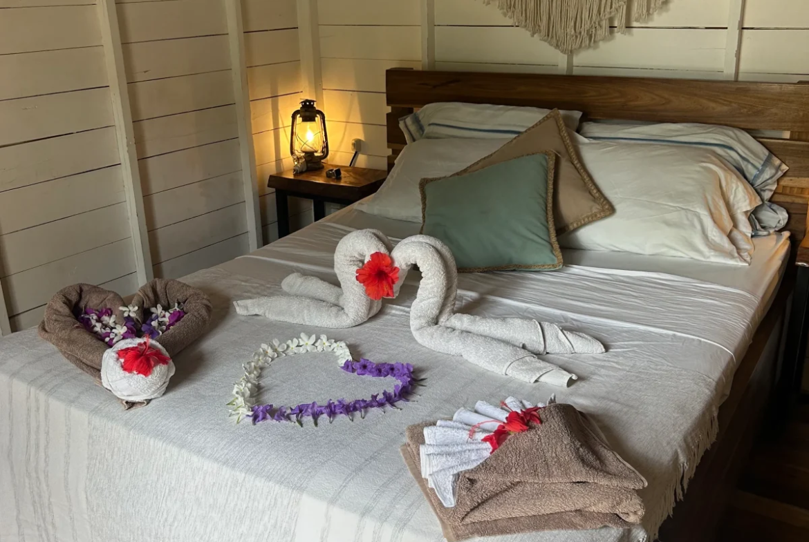 Bright guest room with wooden finishes at Monoloko Lodge, a surf lodge for sale in Popoyo, Nicaragua