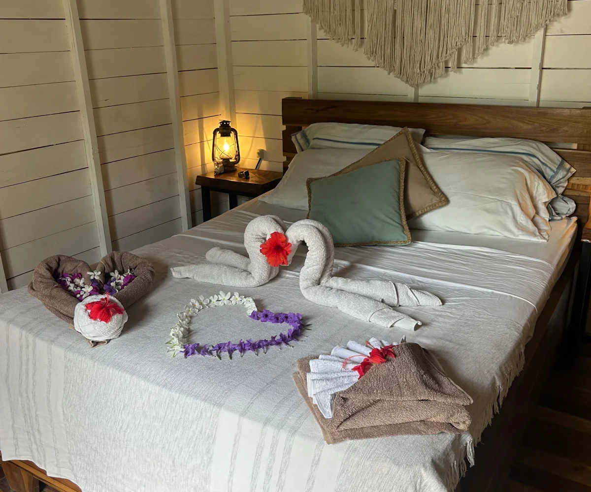 Bright guest room with wooden finishes at Monoloko Lodge, a surf lodge for sale in Popoyo, Nicaragua