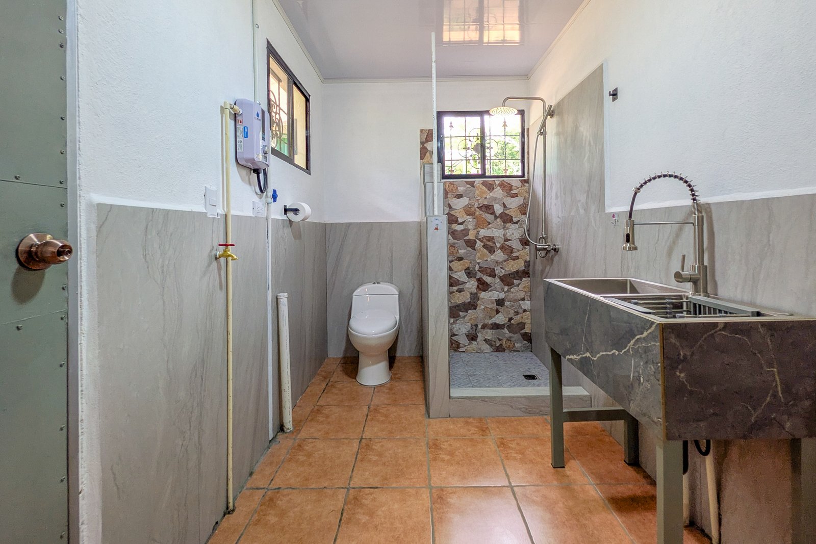 Bathroom with laundry sink