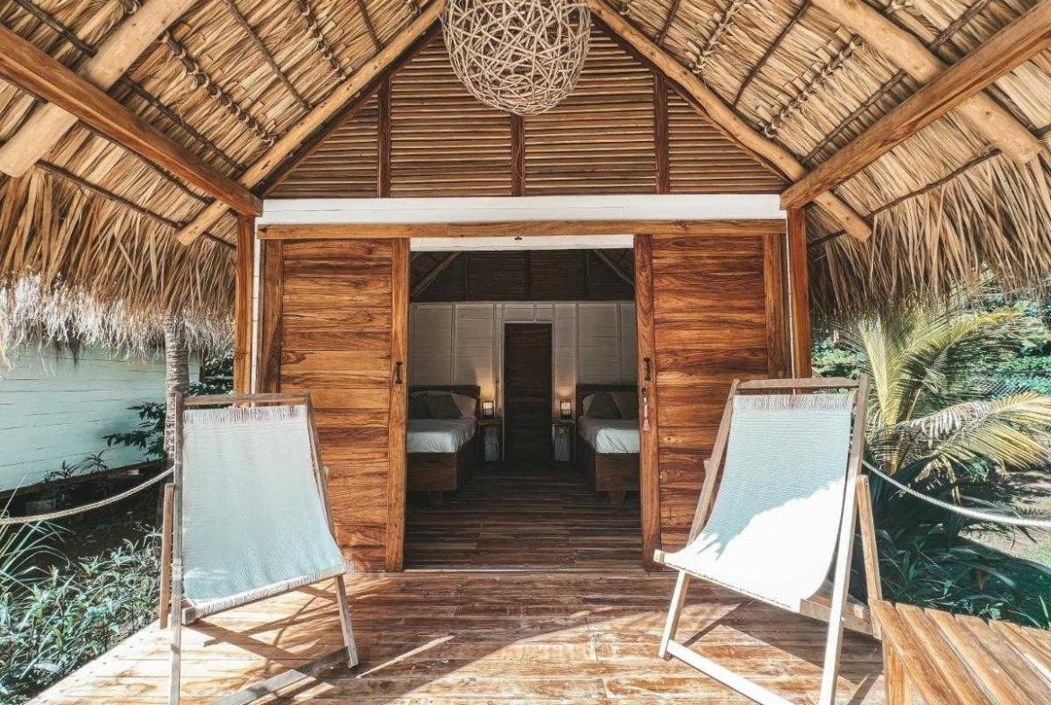 Guest room for two with wooden interiors at Monoloko Lodge surf retreat near Playa Santana, Nicaragua