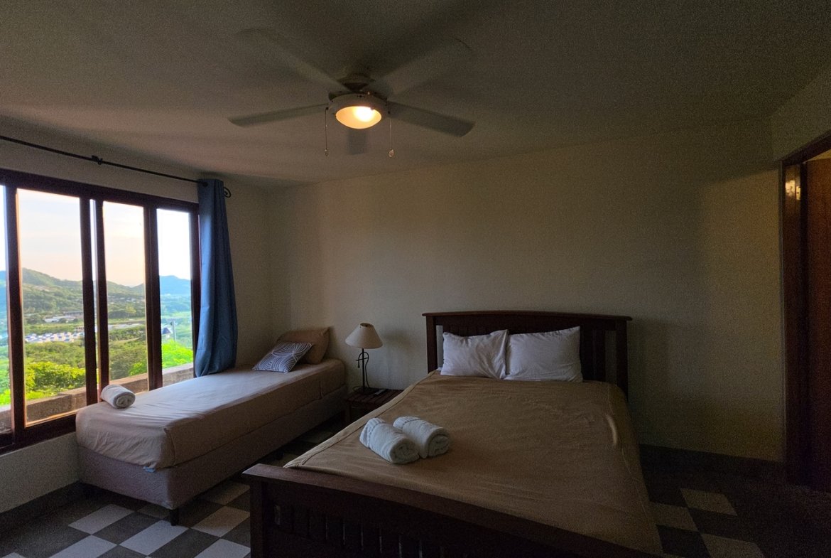 Cozy guest bedroom in a home at Villas de Palermo gated community, San Juan del Sur