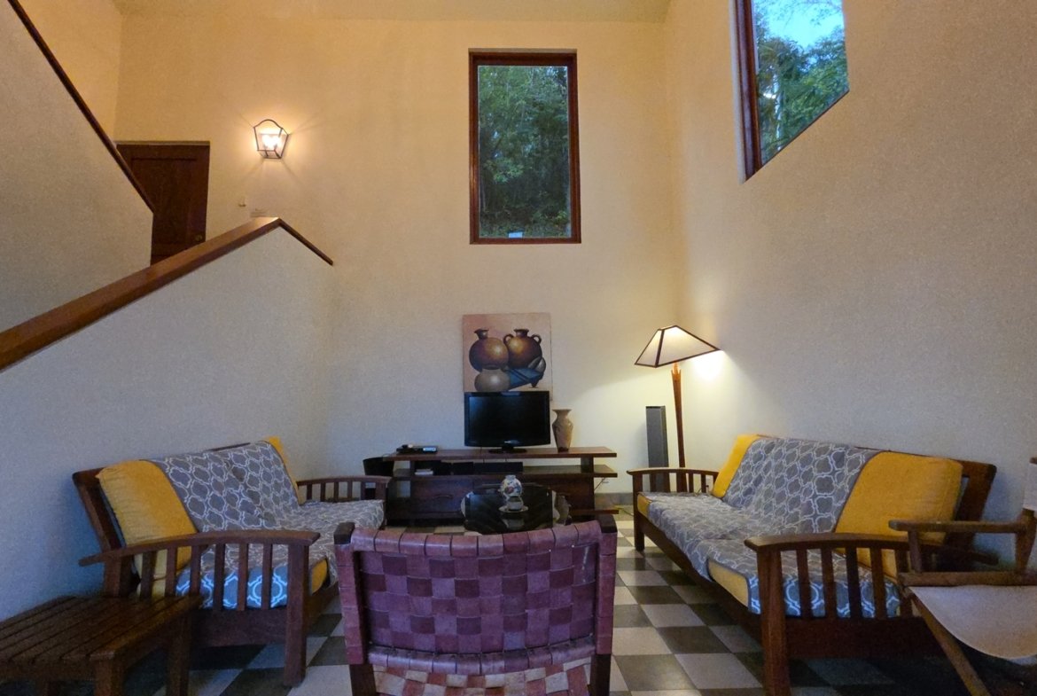 Open living area with comfortable seating at Villas de Palermo, San Juan del Sur, Nicaragua