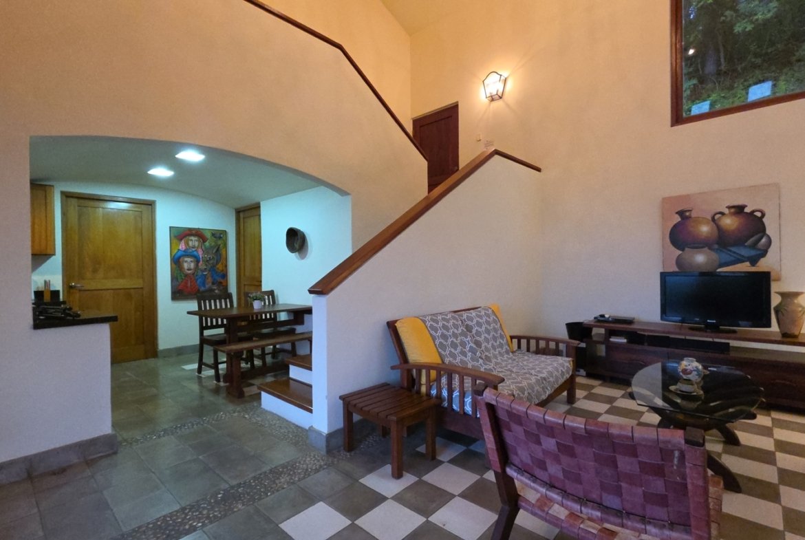 Living room with scenic views in a home for sale at Villas de Palermo, San Juan del Sur