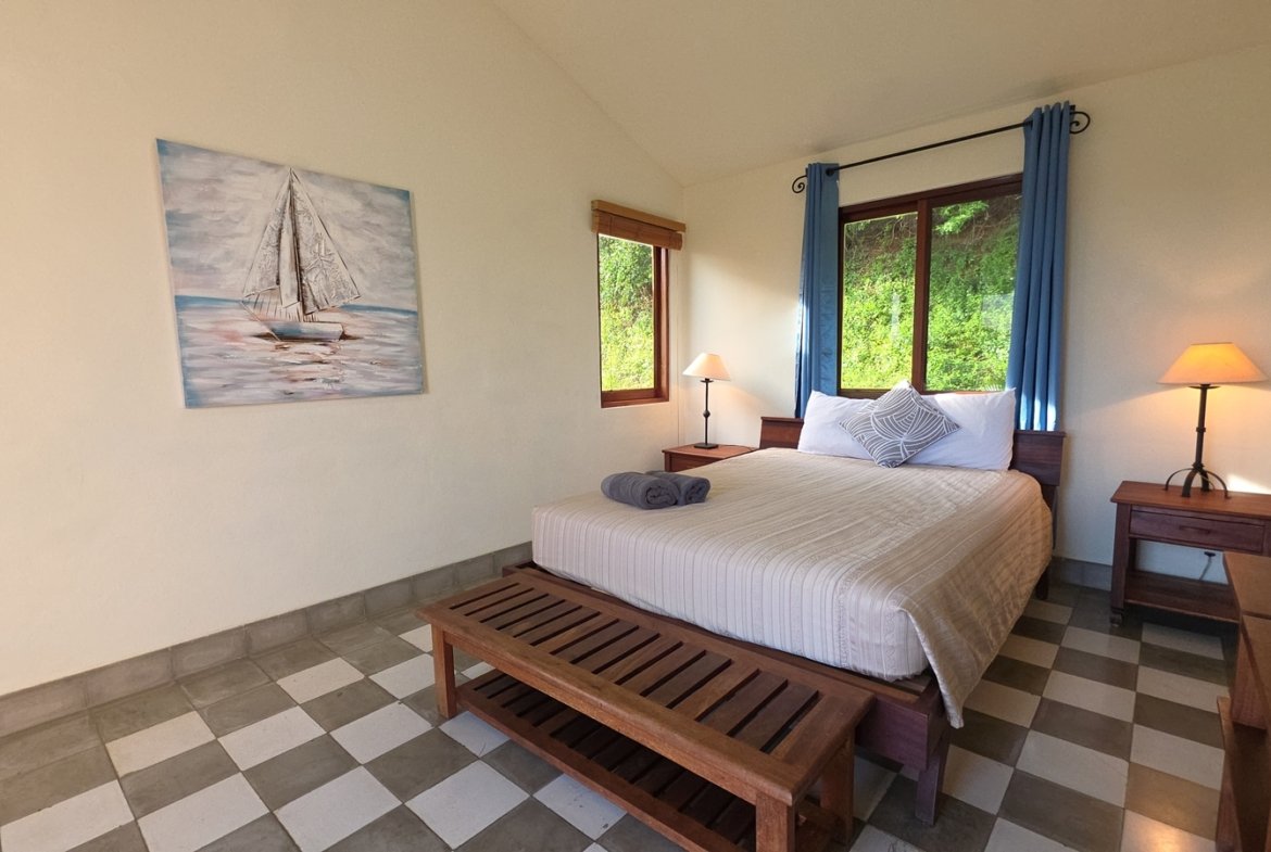 Spacious master bedroom with natural light in a home at Villas de Palermo, Nicaragua