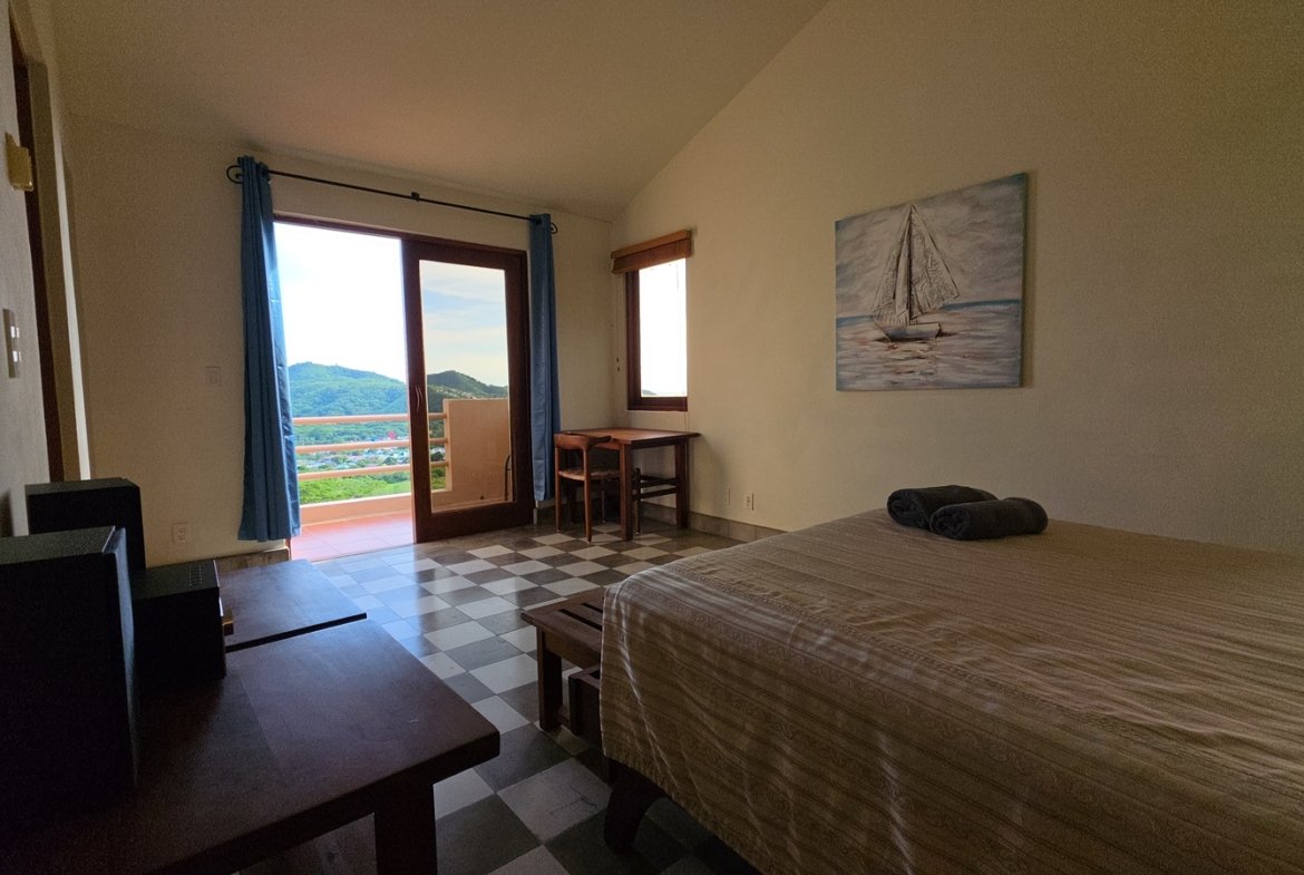 Master bedroom with private terrace access at Villas de Palermo, San Juan del Sur
