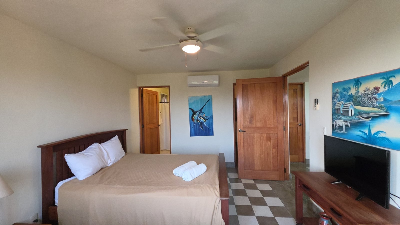 Second bedroom with comfortable bed in a home at Villas de Palermo, San Juan del Sur
