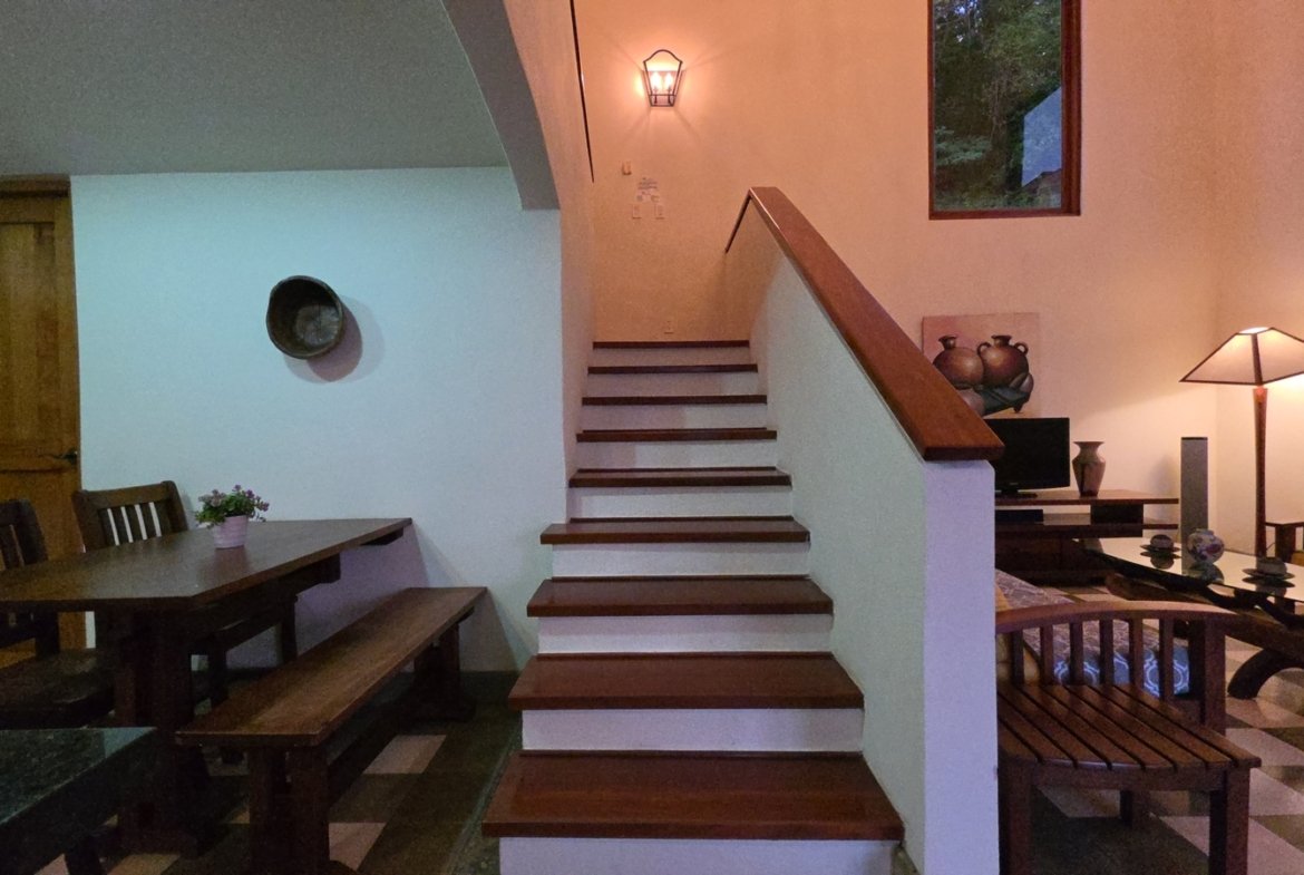 Upper staircase leading to the second floor in a home at Villas de Palermo, San Juan del Sur